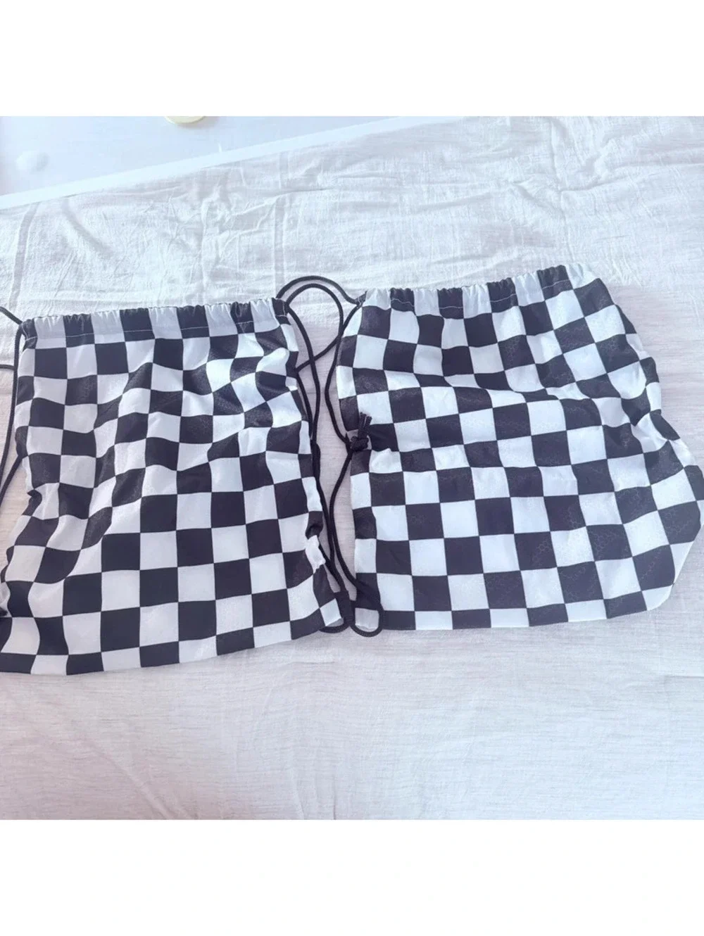 Checkerboard black and white string backpacks